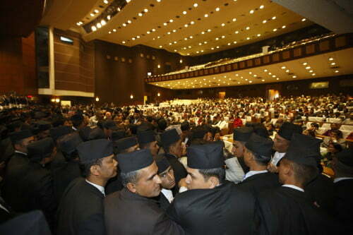 Security personnel try to control Constitution assembly members as they take part in a protest inside the parliament during a meeting at the parliament on the final day to draft the new constitution in Kathmandu January 22, 2015. A new constitution is widely seen as crucial to ending the instability that has plagued Nepal since the end of a Maoist-led civil war in 2006 and settling the republic, nestled between regional powers India and China that jostle to woo a new geopolitical ally. But it has been thwarted by differences among political parties over how to divide the country into federal states. A previous parliament missed several deadlines for the constitution before being dissolved in May 2012 because of deep divisions over the formation of the proposed federal states. A second assembly was elected the following year, and political parties vowed to complete the task of writing the charter on January 22. REUTERS/Navesh Chitrakar (NEPAL - Tags: POLITICS CIVIL UNREST) - RTR4MFLS