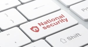 Shield and National Security on computer keyboard background
