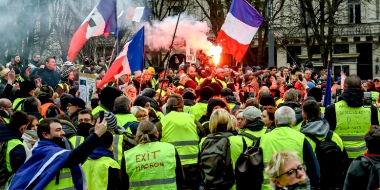 "Yellow vests" (gilets jaunes) protestors take part in an anti-government demonstration in downtown Lille, northern France, on January 5, 2019. - The "yellow vest" movement began in rural France over fuel taxes and quickly ballooned into a wider revolt against the 41-year-old president's pro-business policies and perceived arrogance by low-paid workers and pensioners. (Photo by Philippe HUGUEN / AFP)
