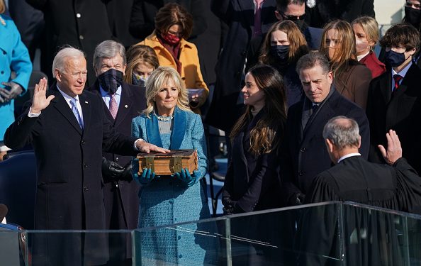 WASHINGTON, DC - JANUARY 20: U.S. President-elect Joe Biden takes the oath of office at the West Front of the U.S. Capitol during the inauguration of Biden on the West Front of the U.S. Capitol on January 20, 2021 in Washington, DC.  During today's inauguration ceremony Joe Biden becomes the 46th president of the United States. (Photo by Erin Schaff-Pool/Getty Images)